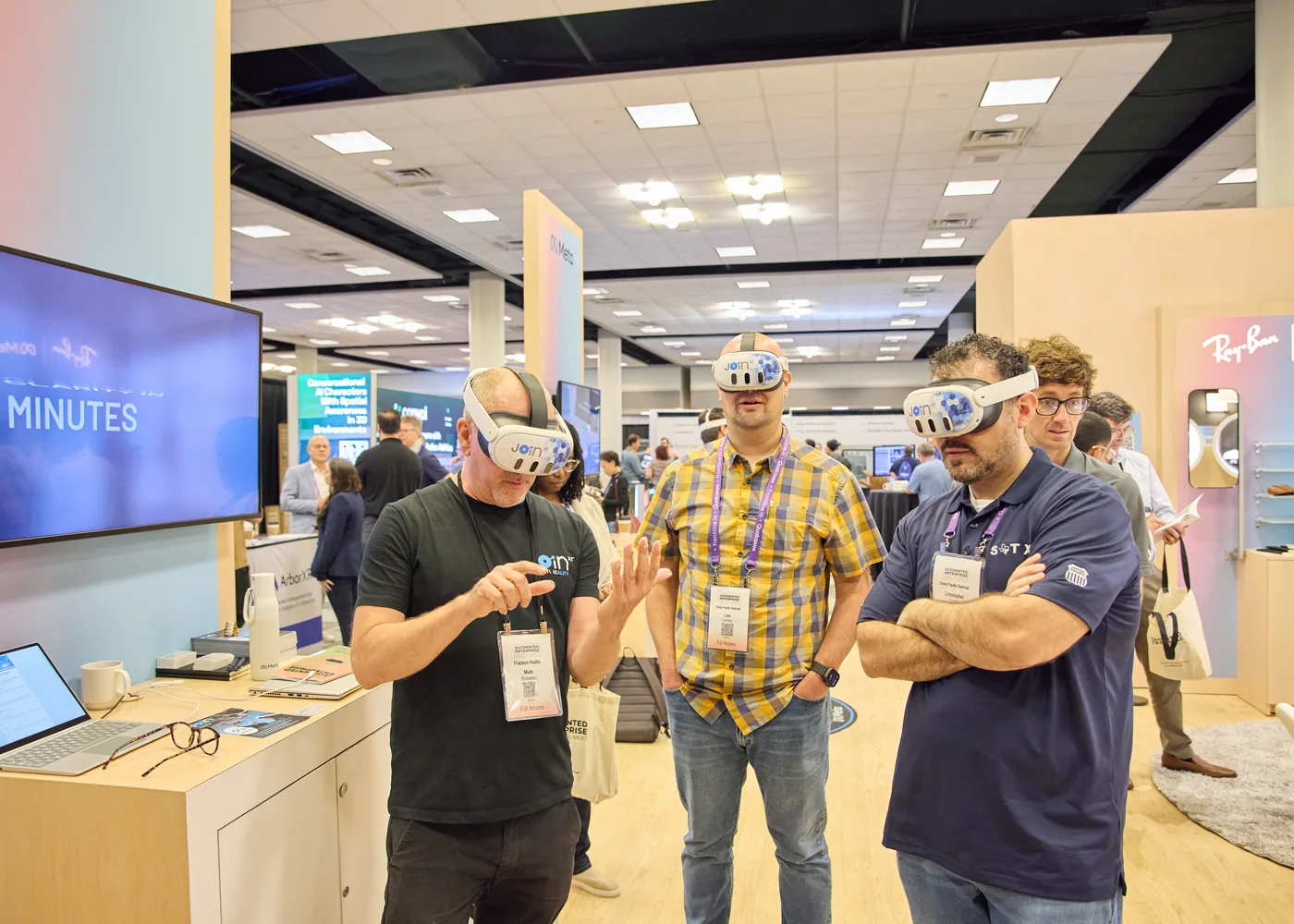 Attendees testing headset technology on the exhibition floor