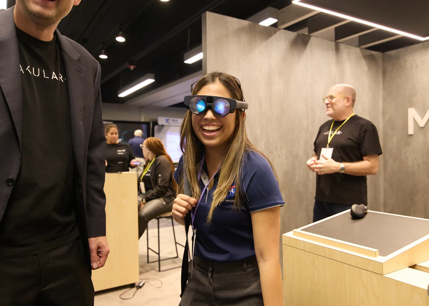 An attendee wearing smart glasses during an enterprise technology demonstration