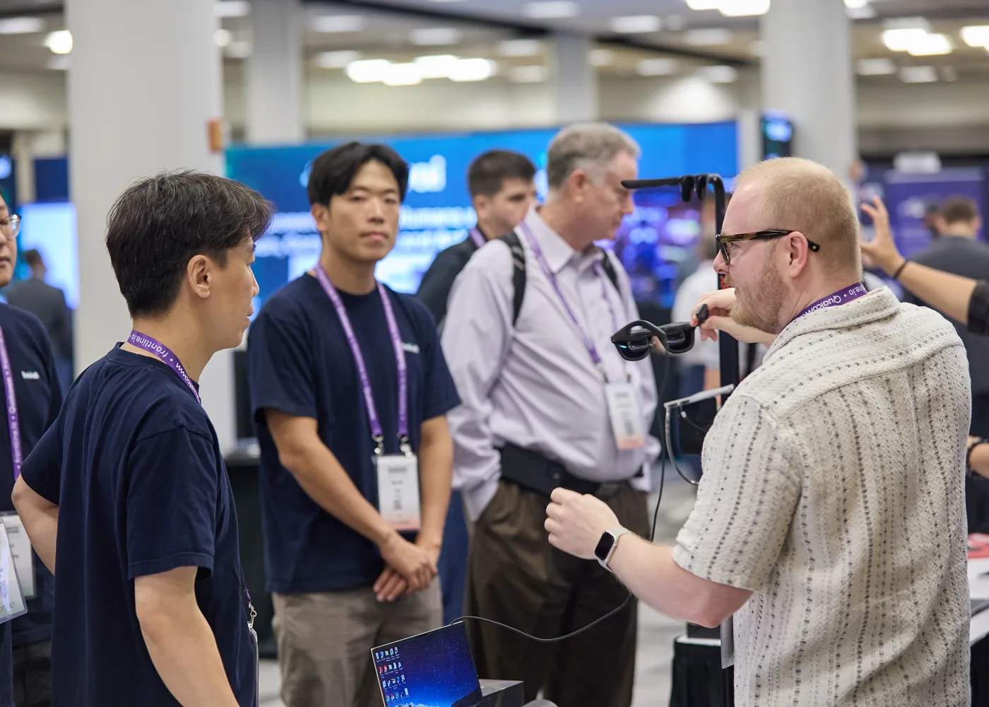 Enterprise technology attendees speaking in a small group on the expo floor